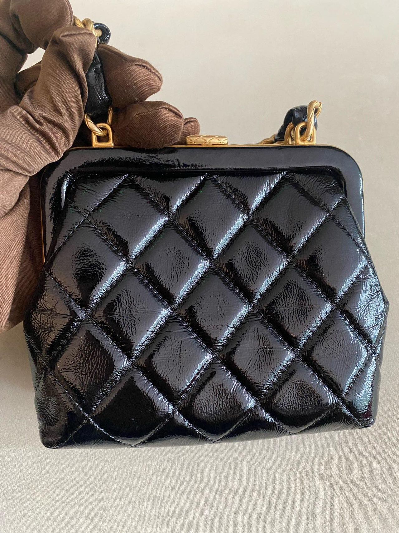 Pre-owned Certified Chanel Ribbon Clutch with Chain in Shiny Black Calfskin with Golden Hardware, microchipped, 2024, w/ dust bag