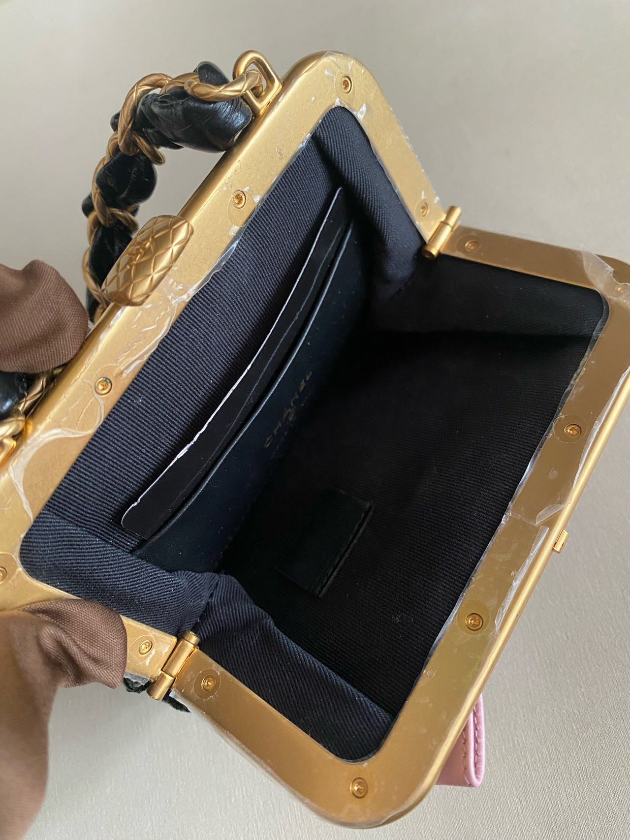 Pre-owned Certified Chanel Ribbon Clutch with Chain in Shiny Black Calfskin with Golden Hardware, microchipped, 2024, w/ dust bag