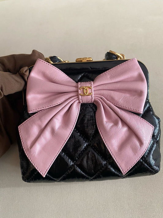 Pre-owned Certified Chanel Ribbon Clutch with Chain in Shiny Black Calfskin with Golden Hardware, microchipped, 2024, w/ dust bag