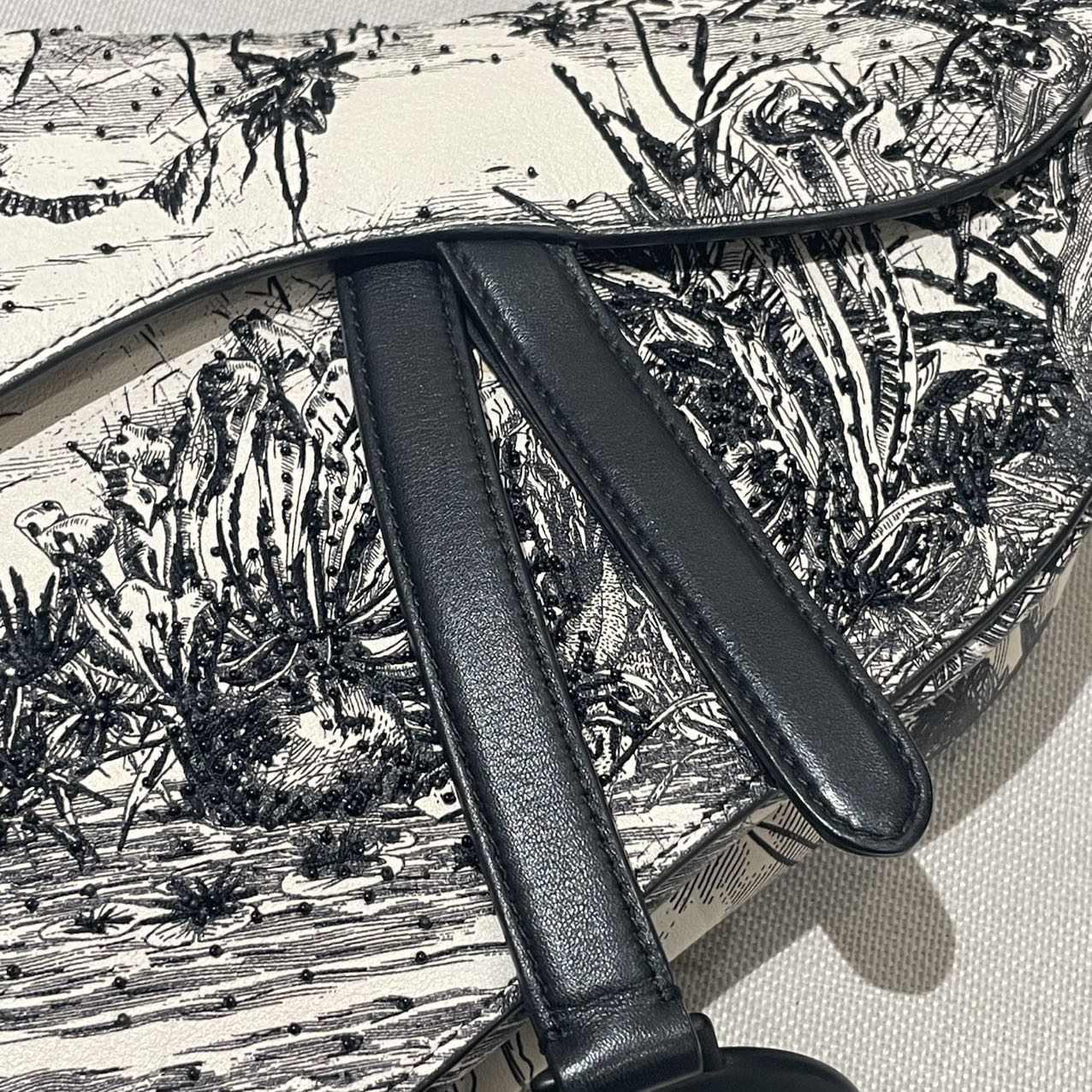 Pre-owned Certified Dior Medium Saddle in White Calfskin with Black Tropical Embroidery, with So Black Hardware, 2019, w/ dust bag