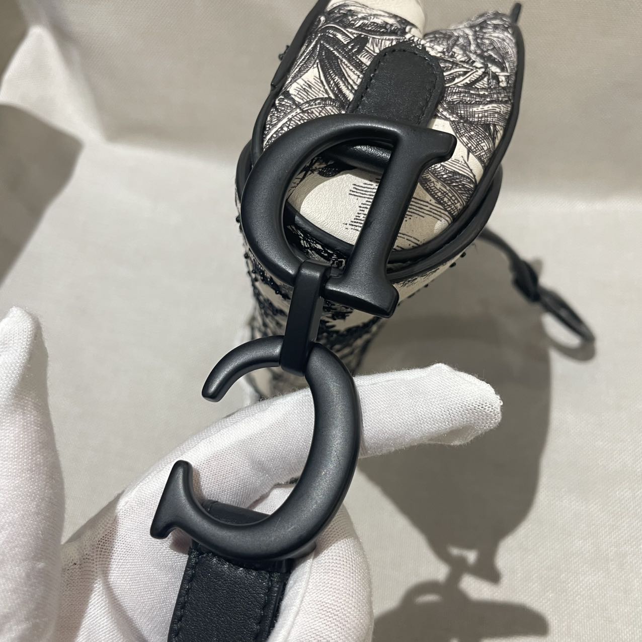 Pre-owned Certified Dior Medium Saddle in White Calfskin with Black Tropical Embroidery, with So Black Hardware, 2019, w/ dust bag