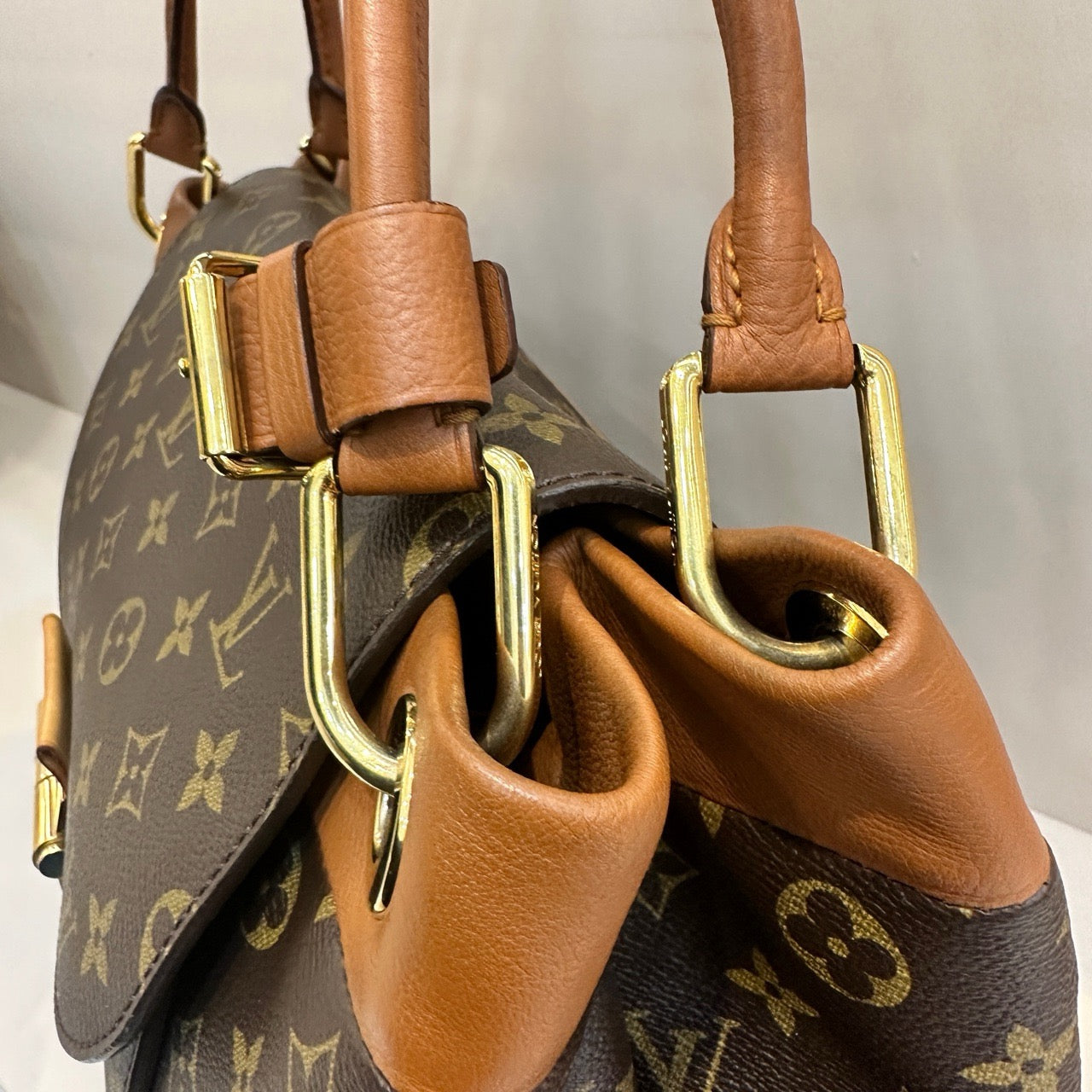 Pre-owned LV Olympe Monogram with Brown Accents