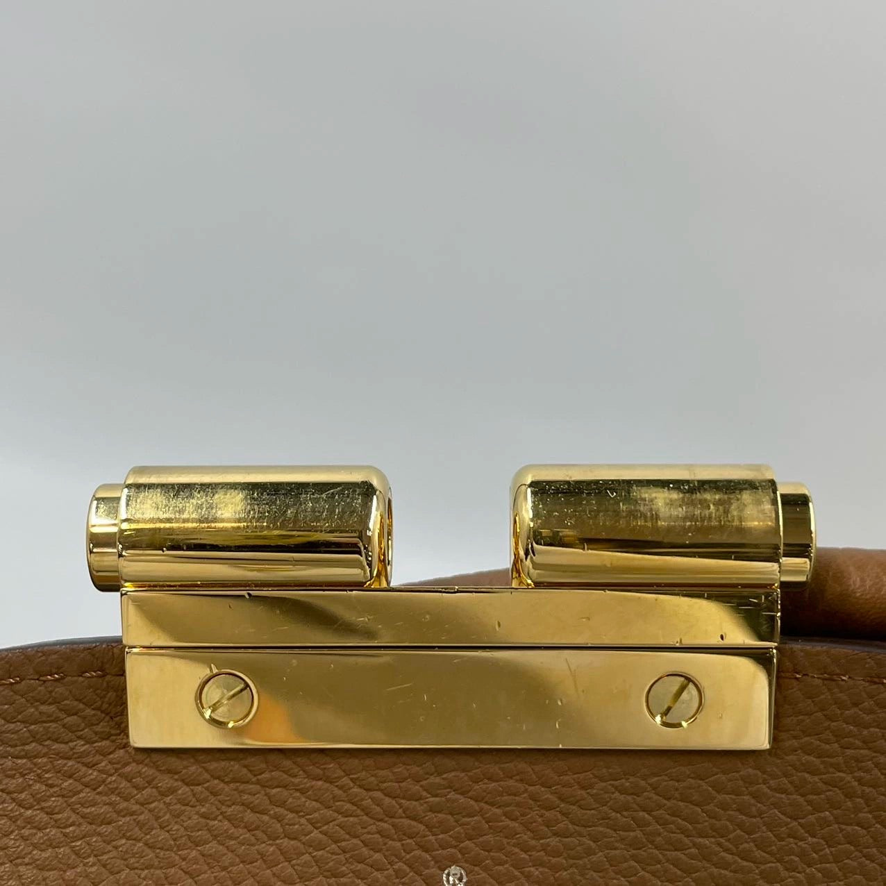 Pre-owned LV Olympe Monogram with Brown Accents, set with a long monogram strap