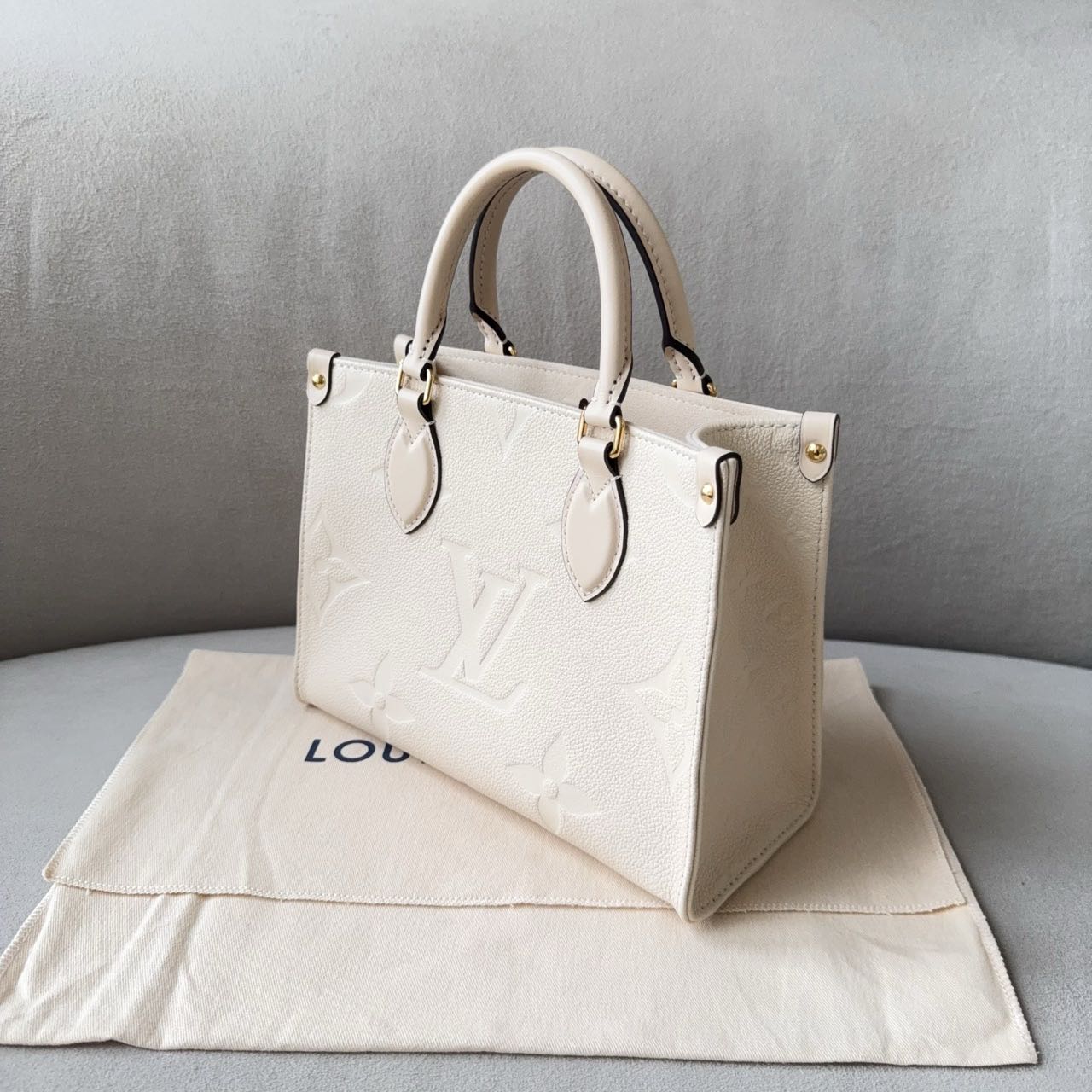 Pre-owned Certified LV Louis Vuitton OnTheGo PM in Cream White Monogram Empreinte Leather with Golden Hardware, 2024 Microchipped, w/full set