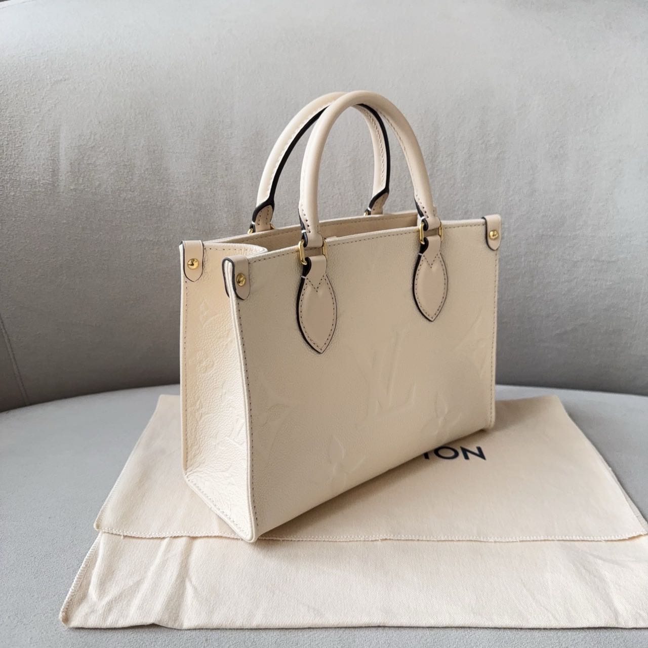 Pre-owned Certified LV Louis Vuitton OnTheGo PM in Cream White Monogram Empreinte Leather with Golden Hardware, 2024 Microchipped, w/full set