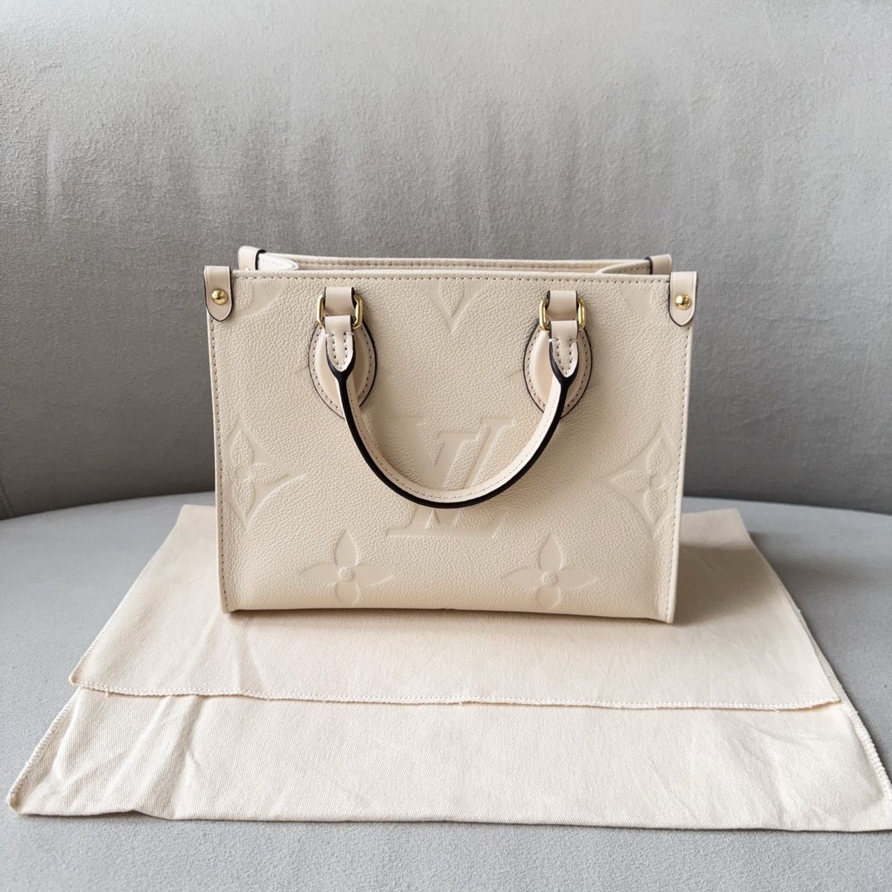 Pre-owned Certified LV Louis Vuitton OnTheGo PM in Cream White Monogram Empreinte Leather with Golden Hardware, 2024 Microchipped, w/full set