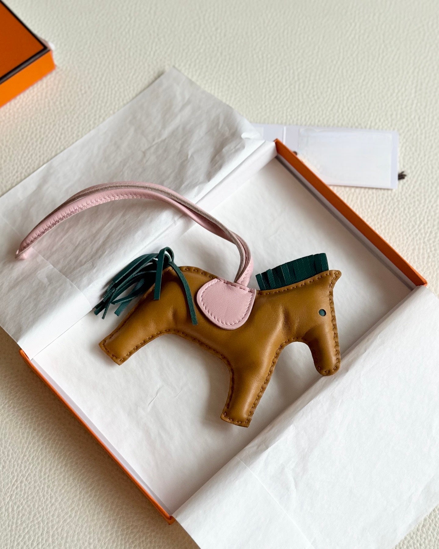 Pre-owned Certified Hermes Medium Rodeo Charm in Sesame Lambskin with Malachite and Rose Sakura, 2020, w/ box