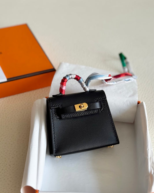 Pre-owned Certified Hermes Kelly Twilly Bag Charm in Black Swift Leather with Golden Hardware, w/ box