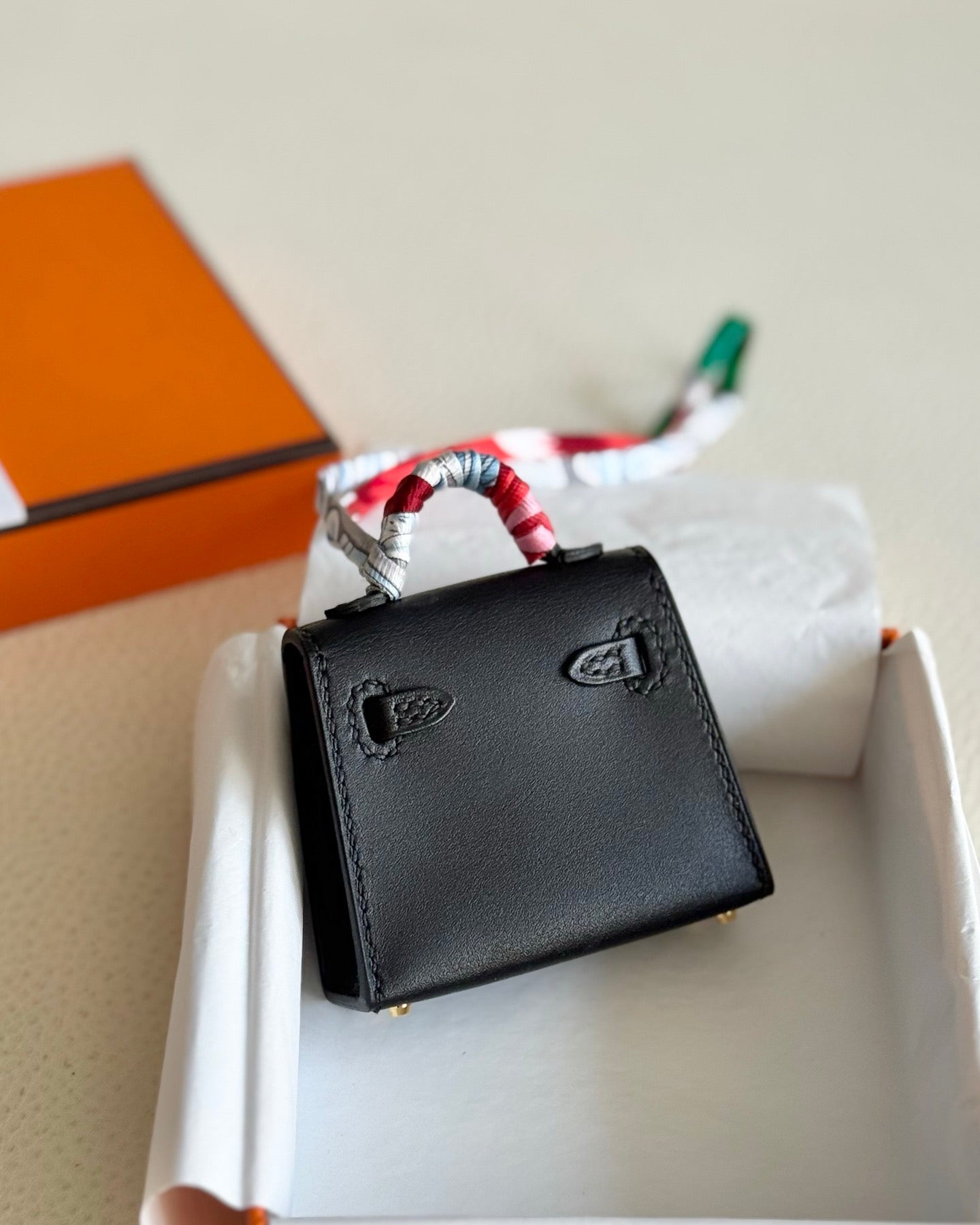 Pre-owned Certified Hermes Kelly Twilly Bag Charm in Black Swift Leather with Golden Hardware, w/ box